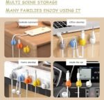 Colorful thumb-shaped cable clips holding a charging wire on a desk