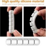 White 3 Slot Cable Organizer holding phone charger and USB cords on a nightstand