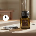 Luxury 200ml transparent reed diffuser bottle with black reeds on a modern table.