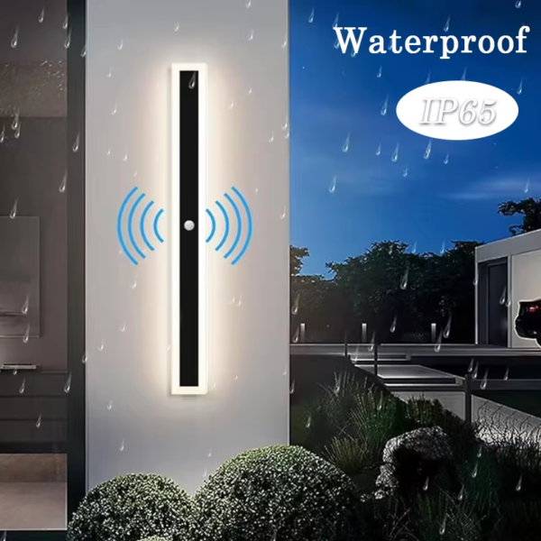 Long minimalist black LED wall light with acrylic enclosure on a modern exterior wall