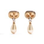 Valentino Garavani Ovalette earrings featuring gold-tone VLogo, Swarovski crystals, and pearl drops.
