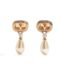 Valentino Garavani Ovalette earrings featuring gold-tone VLogo, Swarovski crystals, and pearl drops.