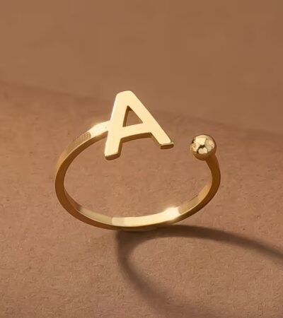 Everly 10k Yellow Gold Initial A Open Ring with April Birthstone flush-set.