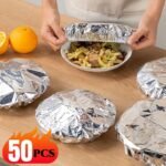 A pack of 50 silver reusable aluminum foil elastic covers for food preservation.