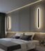 100cm long black minimalist LED wall light with 3000K warm white glow