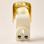 Gold crystal-embellished electrical wall plug-in with an Oud fragrance refill.