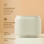 Black electric aroma diffuser with orange LED flame-effect mist.