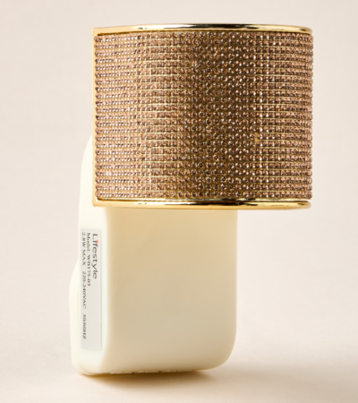 Gold crystal-embellished electrical wall plug-in with an Oud fragrance refill.