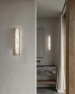 Leldashti waterproof LED wall light with an iron finish and copper accents is mounted on a modern wall.