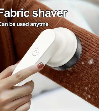 Handheld electric fabric shaver with six stainless steel blades and ergonomic grip for lint removal.