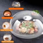 Two clear microwave food box covers over plates of broccoli and salad on a wooden table.