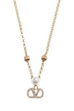 The Valentino Garavani VLogo Signature necklace featuring a pearl and Swarovski crystal pendant on a gold-tone chain.