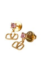 Close-up of Valentino Garavani VLogo earrings in gold-tone metal with rhinestones