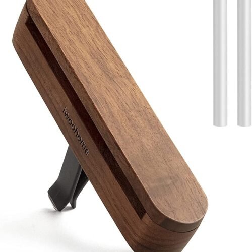 Round wooden car essential oil diffuser with magnetic lid and silicone-protected vent clip.