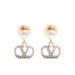 Valentino Garavani VLogo Signature earrings featuring pearls and Swarovski crystals on gold-tone metal.