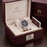 Aigner Fermo men's watch in silver and rose gold two-tone with a blue dial.