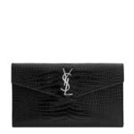 Front view of YSL Uptown Pouch in black crocodile-embossed leather with silver YSL initials