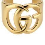 Gucci GG Marmont Cuff Bracelet in polished brass featuring the Double G logo.