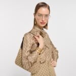 Gucci GG Marmont Cuff Bracelet in polished brass featuring the Double G logo.