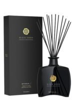 The Ritual of Oudh Fragrance Sticks in a luxury black glass bottle.