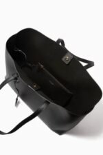 Saint Laurent East/West black leather tote bag with gold YSL charm and detachable pouch.