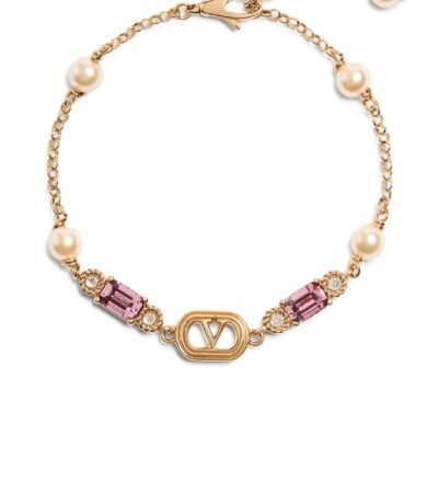 Valentino Garavani Ovalette bracelet in gold-finish metal with pearls and Swarovski crystals.