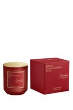 The Maison Francis Kurkdjian Baccarat Rouge 540 candle in an elegant frosted red glass jar.