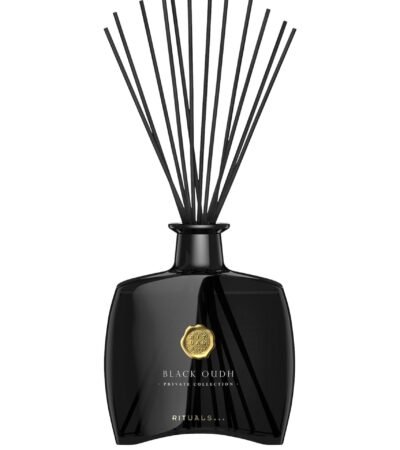 The Ritual of Oudh Fragrance Sticks in a luxury black glass bottle.