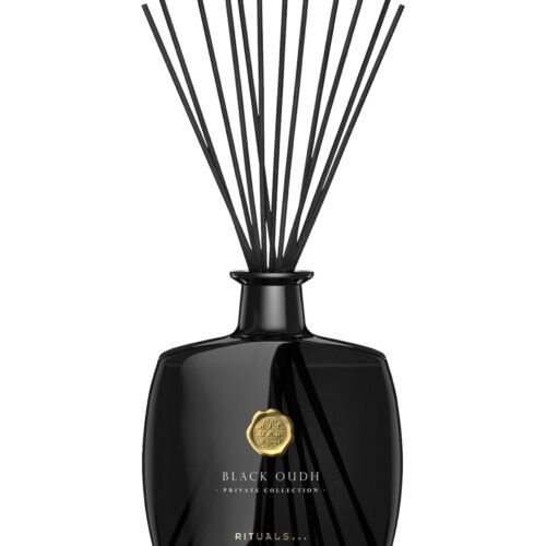 The Ritual of Oudh Fragrance Sticks in a luxury black glass bottle.