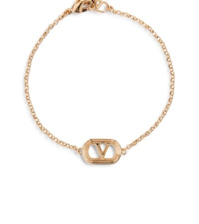 Valentino Garavani Ovalette gold-tone bracelet featuring a Swarovski pearl and VLogo emblem.