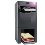 The Foldimate automatic clothes folding machine with neatly folded shirts.