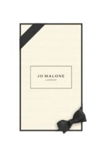 Dark glass Jo Malone London Velvet Rose & Oud diffuser with 10 rattan reeds.