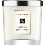A clear glass Jo Malone London Peony & Blush Suede candle with a silver lid.