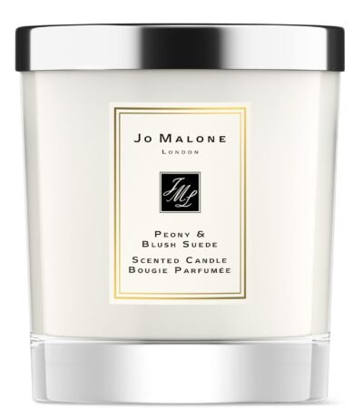 A clear glass Jo Malone London Peony & Blush Suede candle with a silver lid.