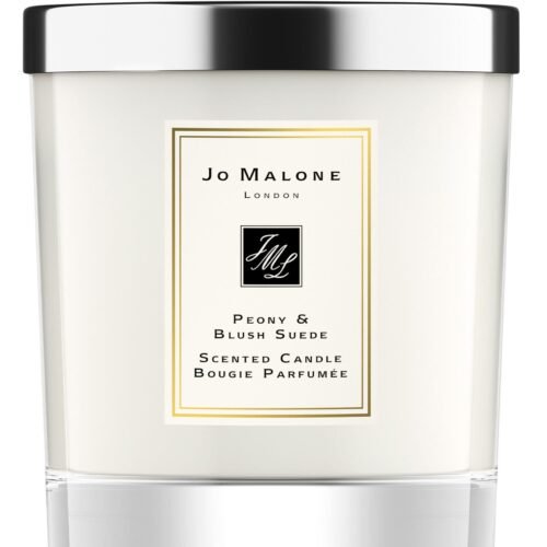 A clear glass Jo Malone London Peony & Blush Suede candle with a silver lid.