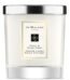 A clear glass Jo Malone London Peony & Blush Suede candle with a silver lid.