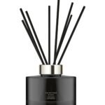 Dark glass Jo Malone London Velvet Rose & Oud diffuser with 10 rattan reeds.