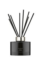 Dark glass Jo Malone London Velvet Rose & Oud diffuser with 10 rattan reeds.