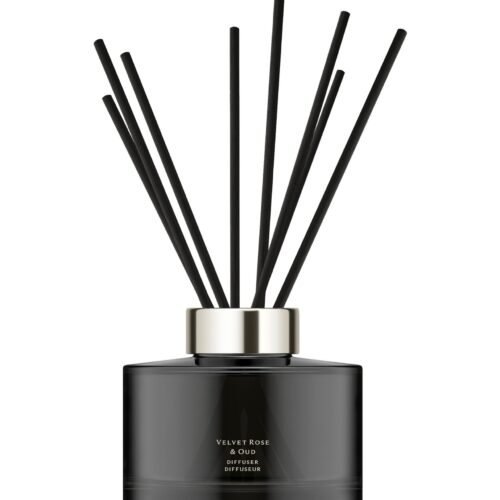 Dark glass Jo Malone London Velvet Rose & Oud diffuser with 10 rattan reeds.