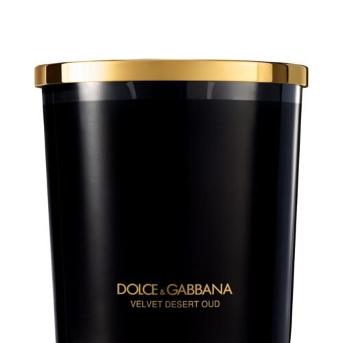 A luxury black glass candle featuring the Dolce & Gabbana Velvet Desert Oud label, presented in a velvet box.